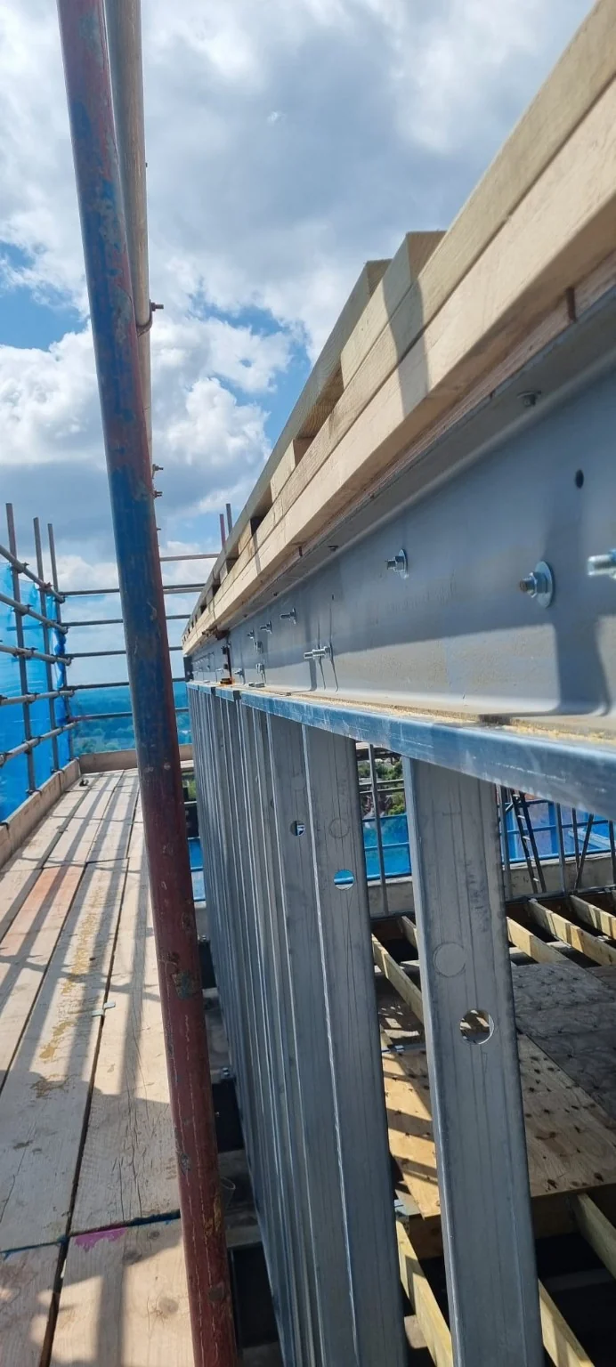 Steel beam connection and lightweight steel stud wall detail