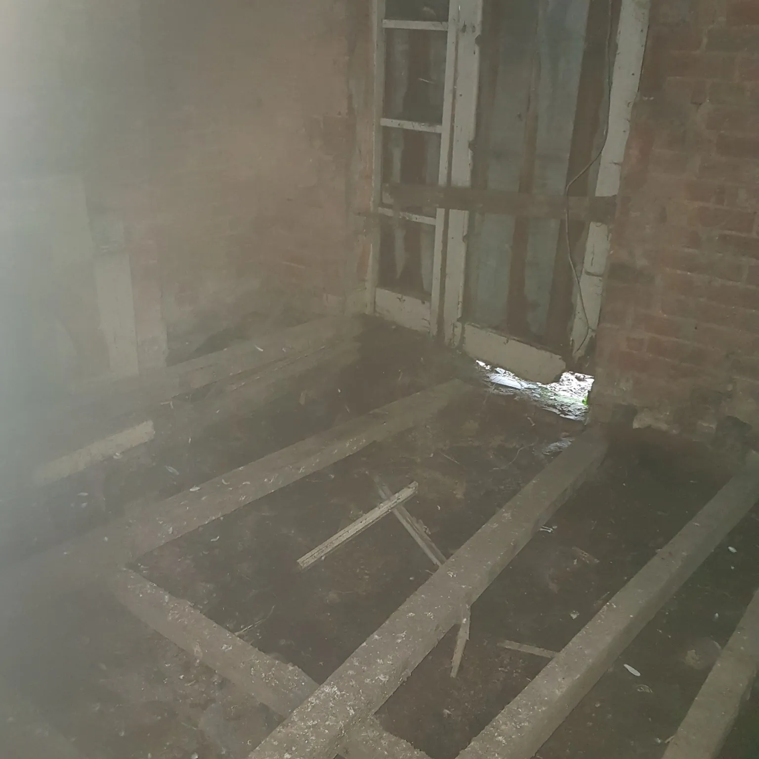Exposed timber floor structure during strip-out